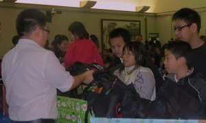 Several attendees leave with bags full of toys to have a wonderful holiday season. 