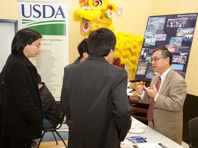 Dr. Chen Yu Yen, (right) VP of Garnett Fleming, answered questions from participants. Garnett Fleming, Inc. was one of the 20 private companies taking part in the 1st Asian Job Skills Seminar & Career Fair. U.S. Department of Agriculture (USDA) and U.S. Department of Justice were also on hand to recruit potential employees. 