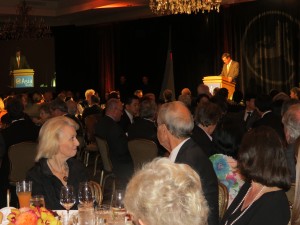 An elegantly dressed audience listens to Arne M. Sorenson, the president and chief executive of Marriott International after he receives the Global Business Leadership Award. 