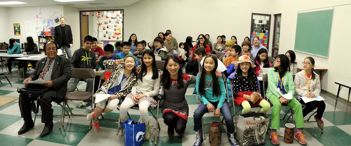 Photo shows Alice Guo, Founder and CEO of Impact Speaking Academy (center), with some of her students.