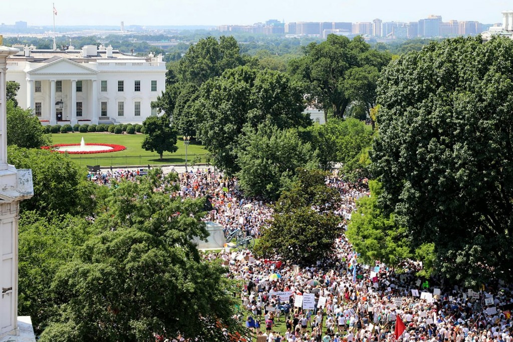 Crowds pack Lafayette Park, across from the White House, for the Families Belong Together rally, one of over 600 held across the country to protest President Trump's immigration policies. Photo source: Twitter @ WomenBelong